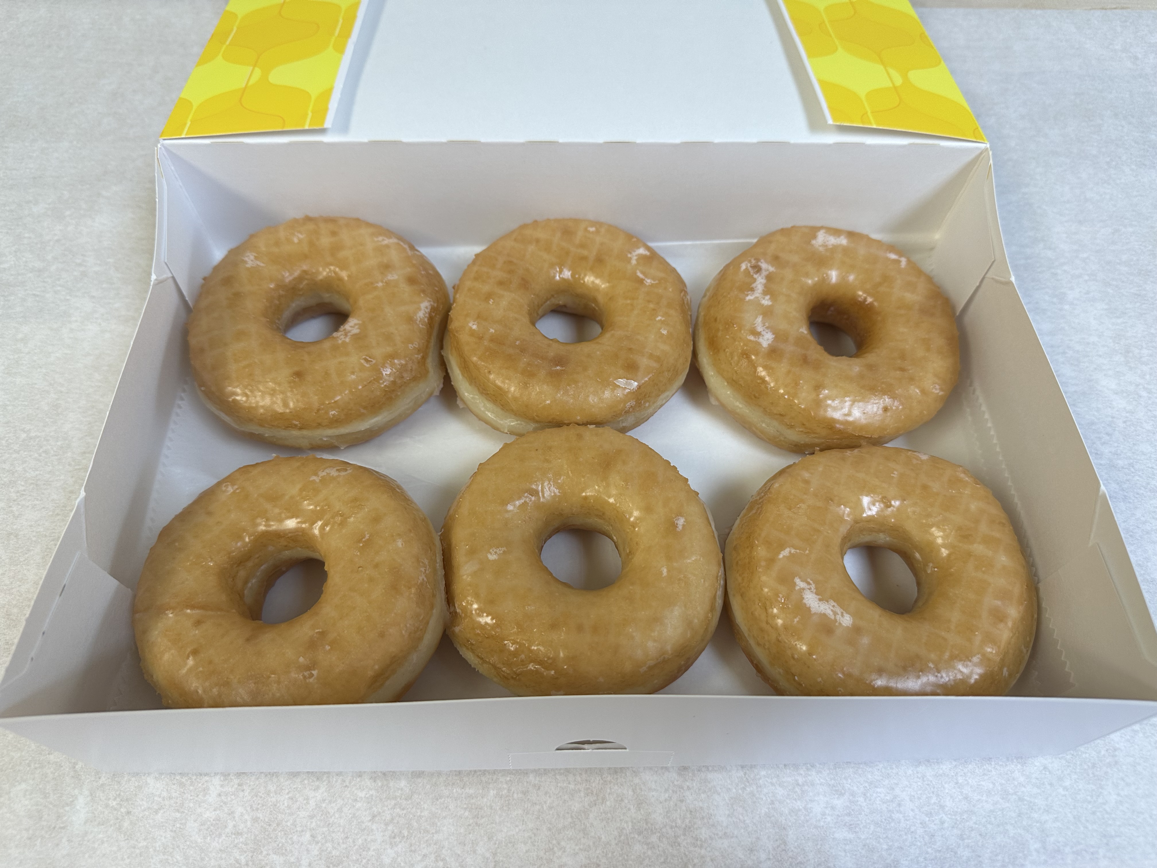 Classic glazed donuts with rainbow sprinkles